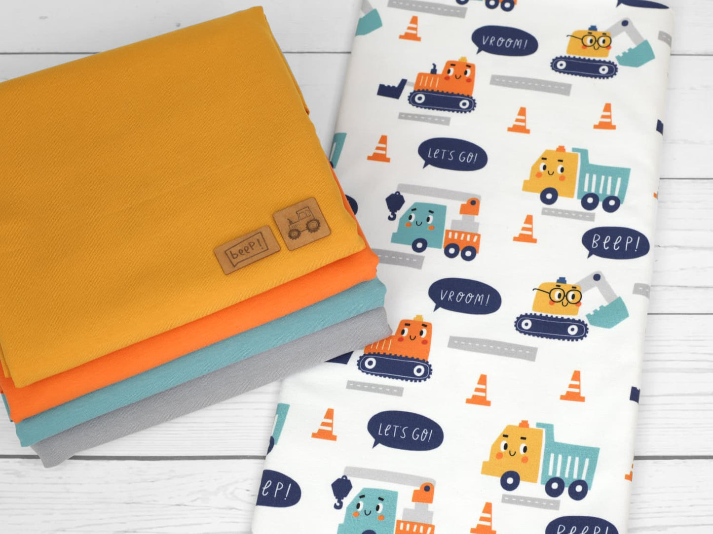 stoff-french-terry-baumwolle-sommersweat-unangeraut-kathi-kunterbunt-baufahrzeuge-mit-gesicht-beep-kombistoffe-2
