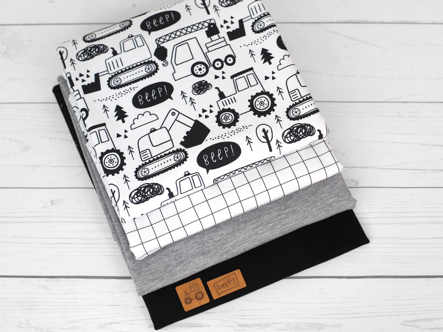 stoff-french-terry-baumwolle-sommersweat-unangeraut-kathi-kunterbunt-baufahrzeuge-schwarz-weiss-kombistoffe