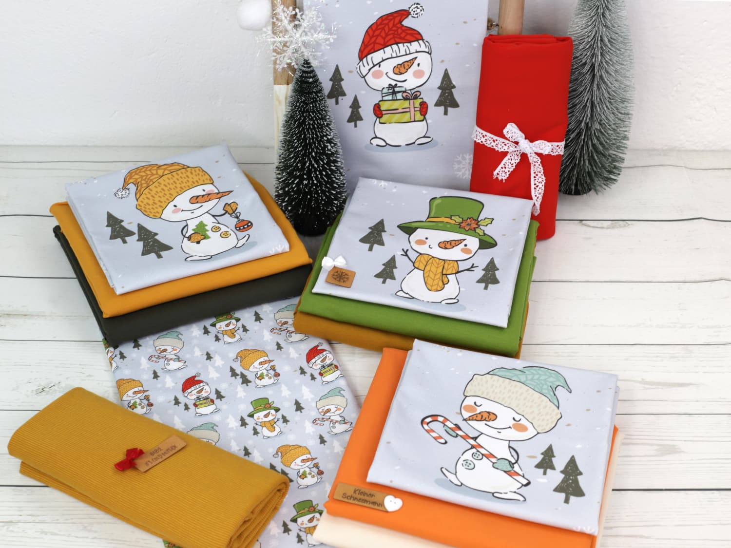 stoff-french-terry-sommersweat-sweat-unangeraut-baumwolle-kathi-kunterbunt-weihnachten-winter-schneemann-tannenbaum-schnee-schneeflocken-blaugrau-serie-2