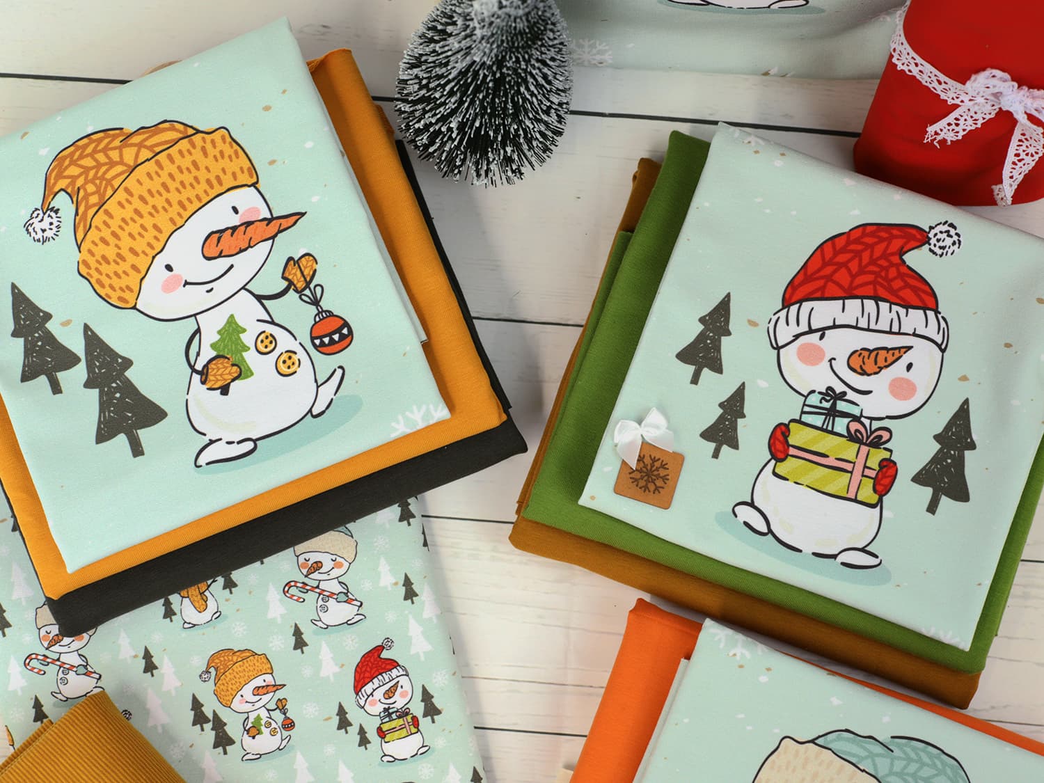 stoff-french-terry-sommersweat-sweat-unangeraut-baumwolle-kathi-kunterbunt-weihnachten-winter-schneemann-tannenbaum-schnee-schneeflocken-mint-serie-2