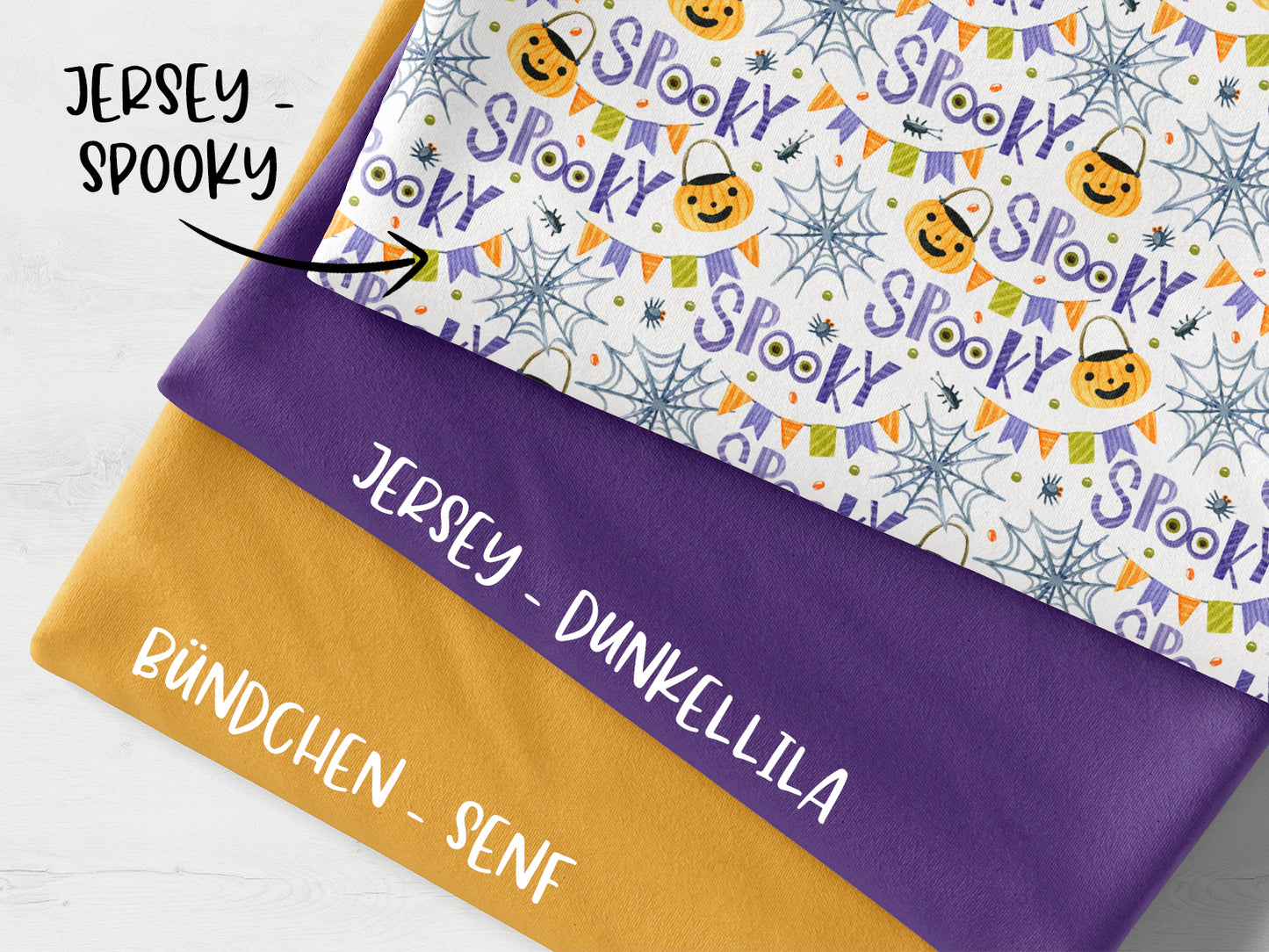 Spooky fabric bundle mustard featuring patterned jersey and solid fabrics in purple and mustard colors.