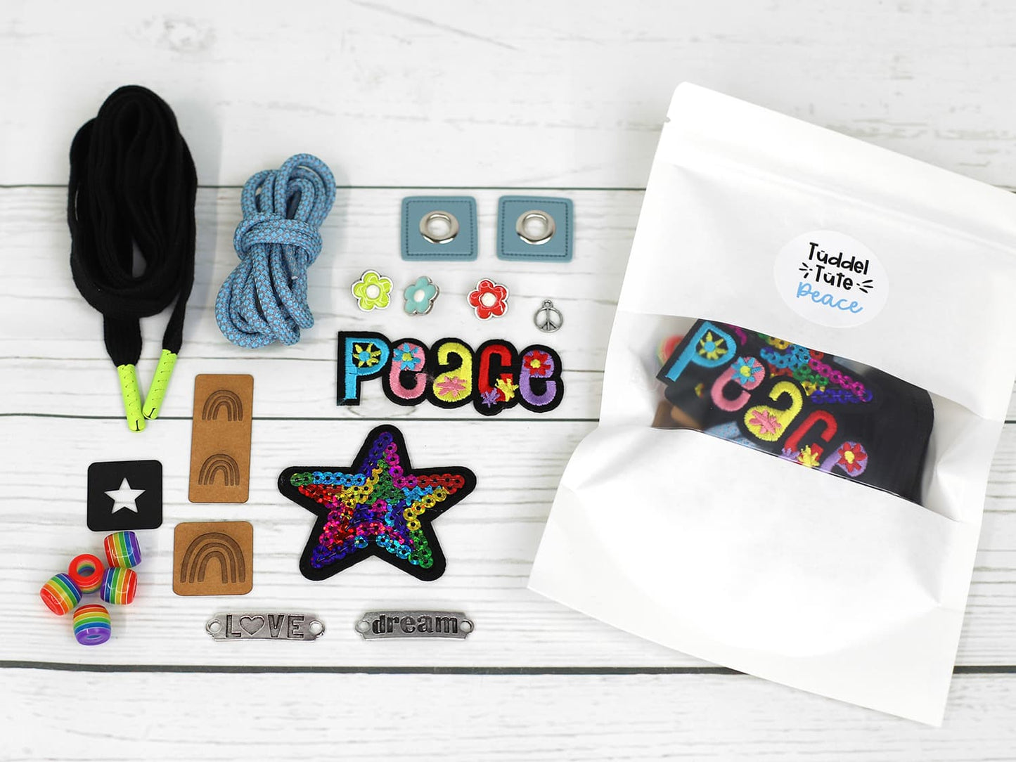 tueddel-tuede-peace-schleife-perlen-oesen-snappap-kordel