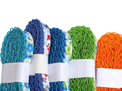 türkis schrägband mit häkelborte in verschiedenen Farben: Blau, Grün, Orange, Blumenmuster.