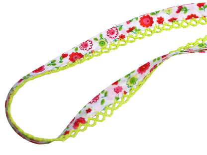 pink floral bias tape with lace trim featuring a colorful floral design and a lemon-colored lace edge.