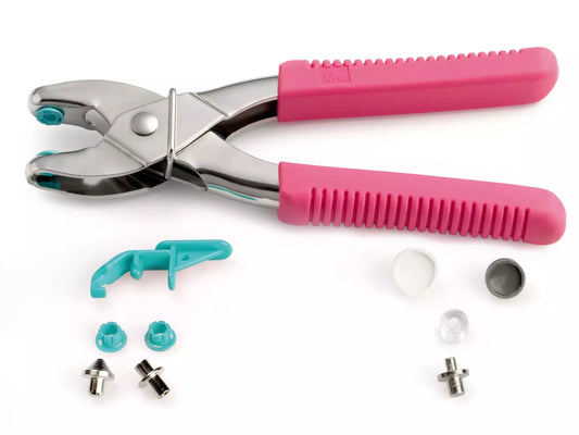 Prym VARIO Druckknopf und Ösenzange pink mit Zubehörteilen auf weißem Hintergrund.