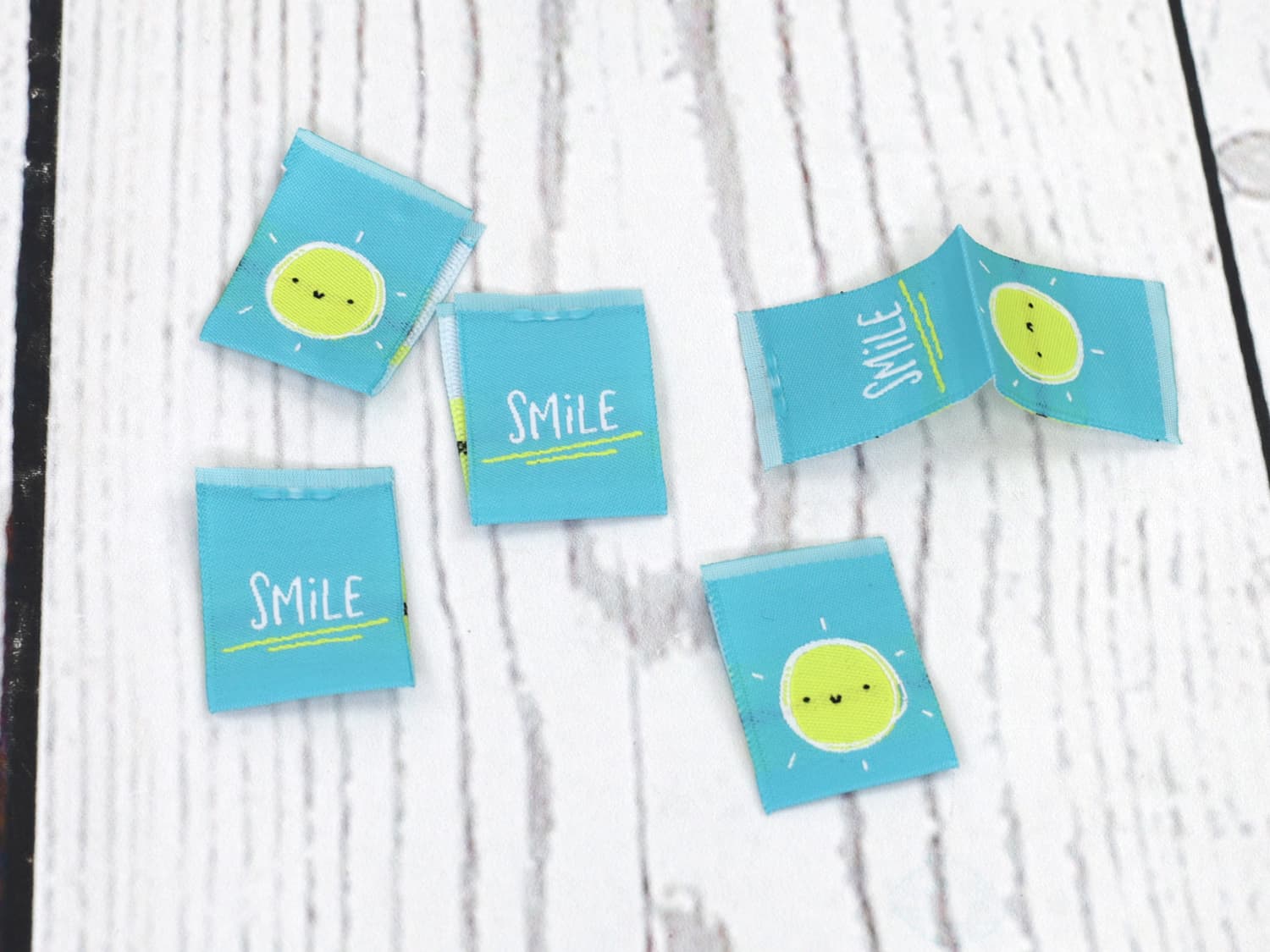 label-webetiketten-smile-sonne-aqua