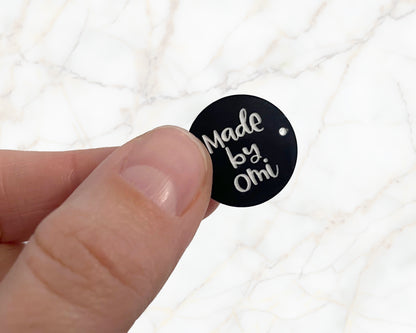 Sew-on label - made by Omi - black