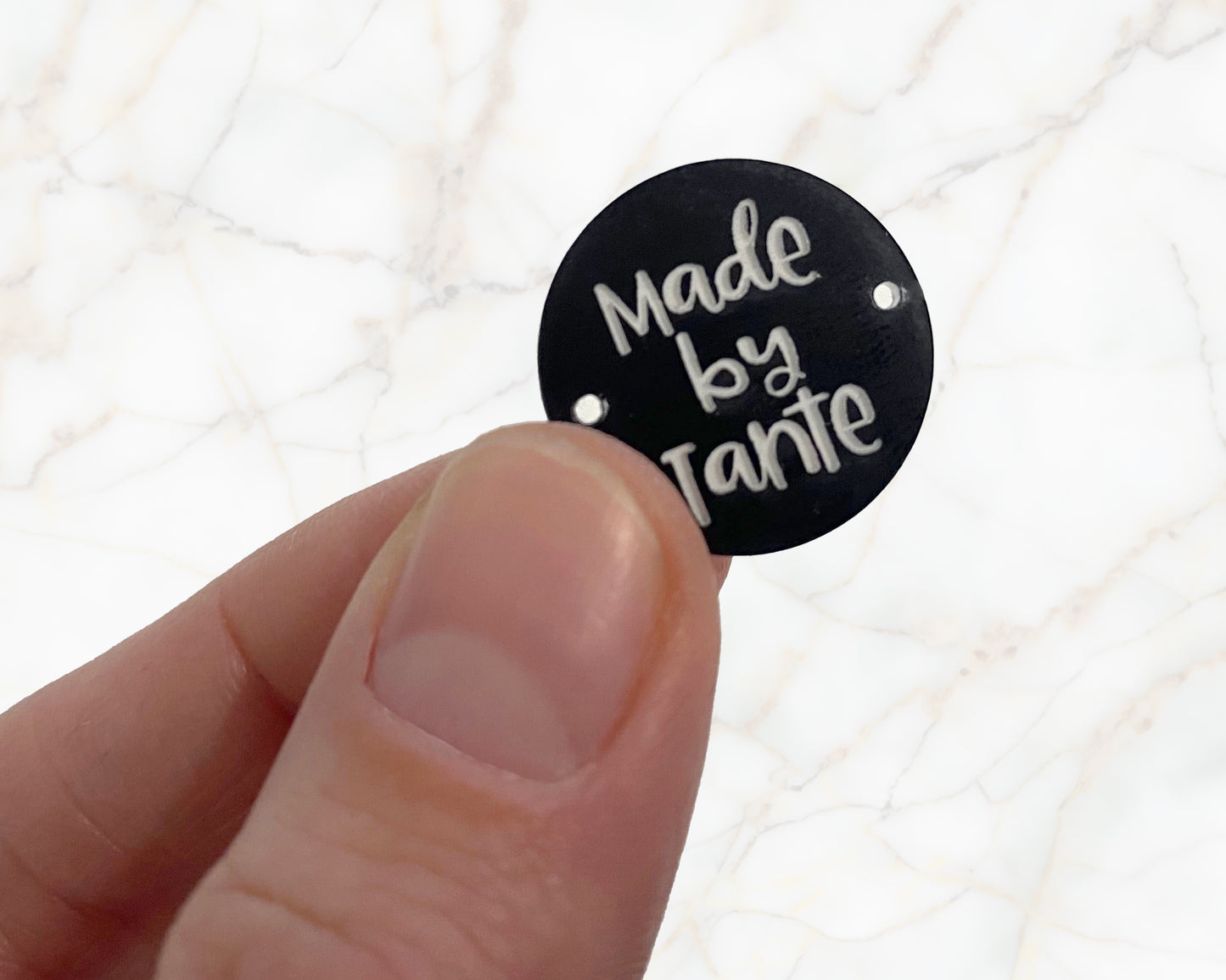Sew-on label - made by Omi - black