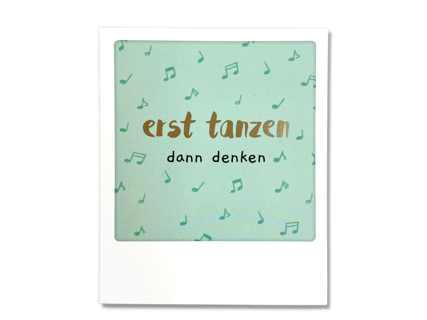 illustrated photo postcard gift featuring the phrase "erst tanzen dann denken" against a musical note background.