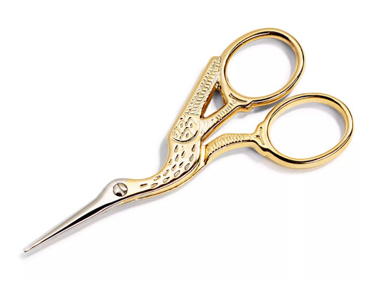 golden embroidery scissors with a stork design, perfect for precise cutting in embroidery and sewing.