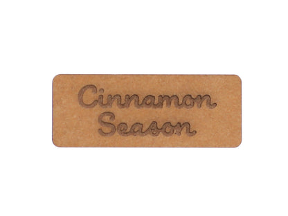 cinnamon snap pap label featuring the text 'Cinnamon Season' on a stylish leather-like material.