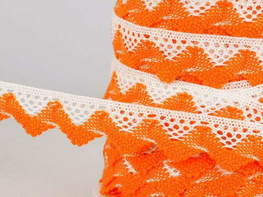 Zweifarbige Spitze 20mm orange weiß auf Rolle, ideal für Handarbeiten und Dekoration.