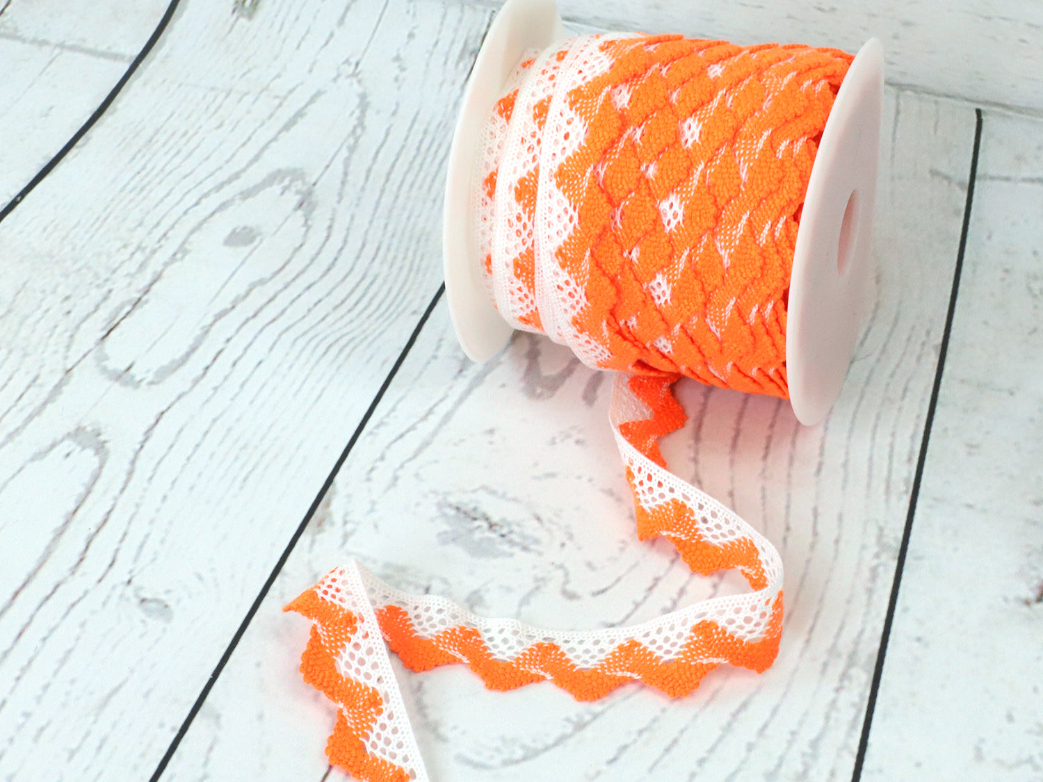 spitze-band-zierband-welle-zweifarbig-weiss-orange