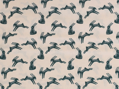 Patchworkstoff - Baumwolle Stoff - Bunnies, light apricot in a playful bunny pattern on a soft cream background.