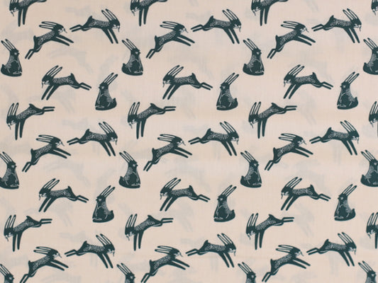 Patchworkstoff - Baumwolle Stoff - Bunnies, light apricot in a playful bunny pattern on a soft cream background.
