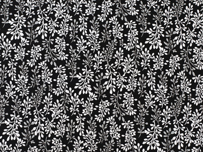 Patchworkstoff - Baumwolle Stoff - Fade to Black, Leaves in einem eleganten Muster aus weißen Blättern auf schwarzem Hintergrund.