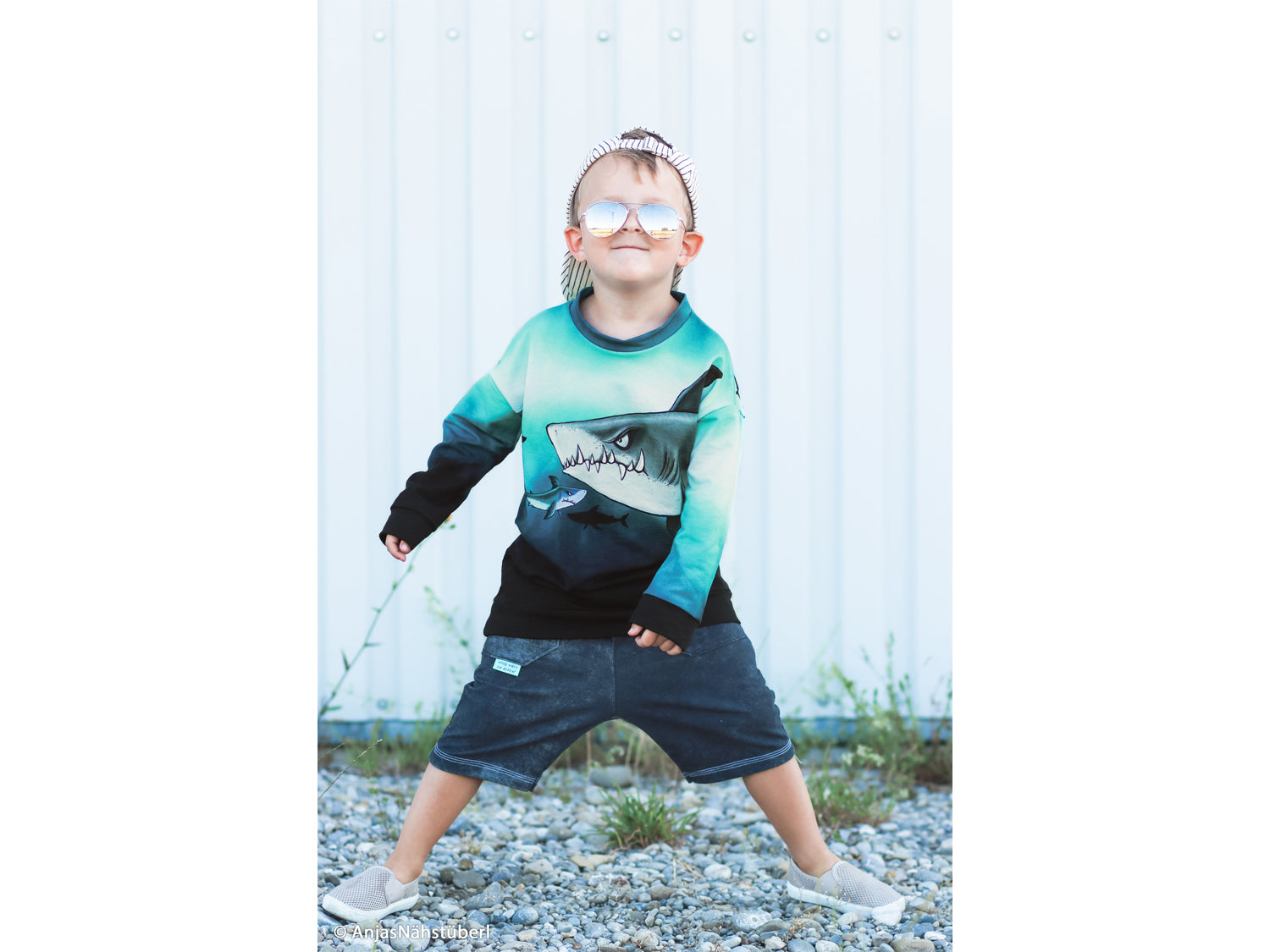 Child wearing French Terry PANEL - Thorsten Berger - Shark Tank, Big Shark, stylishly posing outdoors.