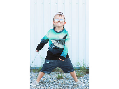 Child wearing French Terry PANEL - Thorsten Berger - Shark Tank, Big Shark, stylishly posing outdoors.