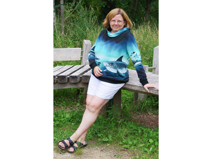 French Terry PANEL - Thorsten Berger - Shark Tank, Big Shark hoodie worn casually on a bench in nature.