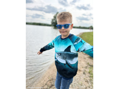 Child wearing French Terry PANEL - Thorsten Berger - Shark Tank, Big Shark sweatshirt by the water.