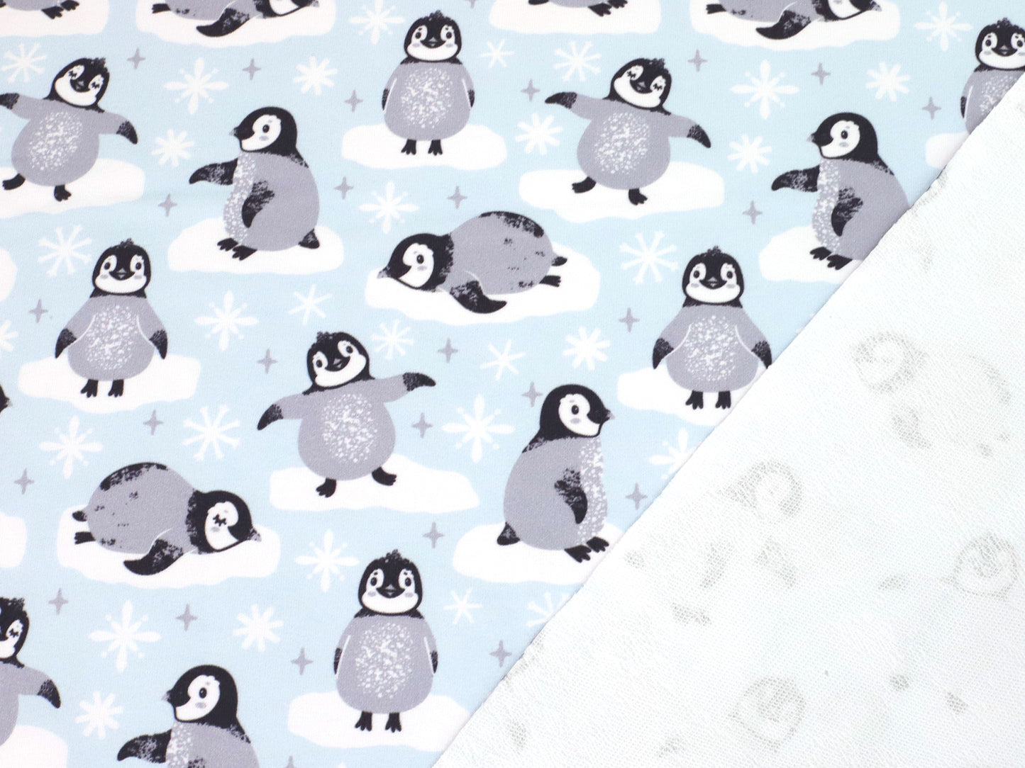 stoff-french-terry-sommersweat-sweat-baumwolle-pinguin-auf-eis-scholle-blau