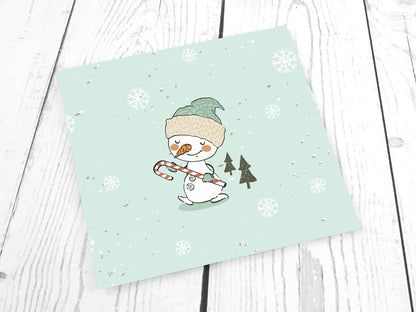 stoff-french-terry-sommersweat-sweat-unangeraut-baumwolle-kathi-kunterbunt-weihnachten-winter-schneemann-tannenbaum-schnee-schneeflocken-mint-panel-schneemann-mit-zuckerstange