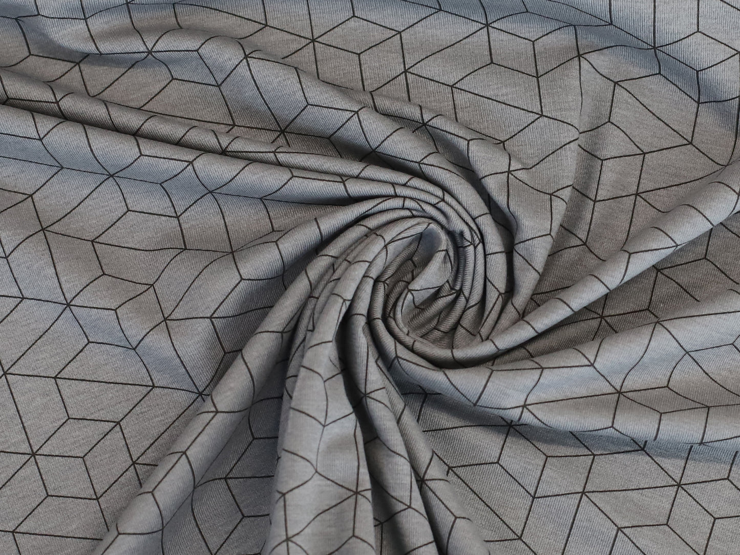 grau jersey stoff mit grafischem muster in 3D-würfelform auf Baumwolljersey