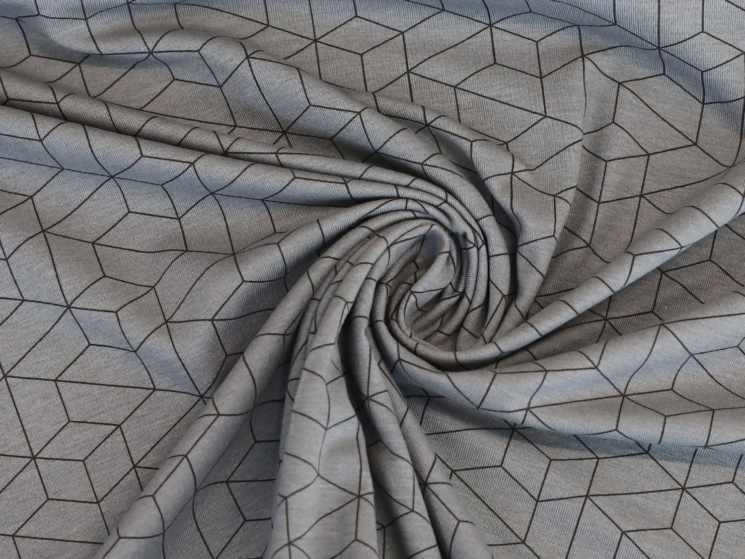 grau jersey stoff mit grafischem muster in 3D-würfelform auf Baumwolljersey