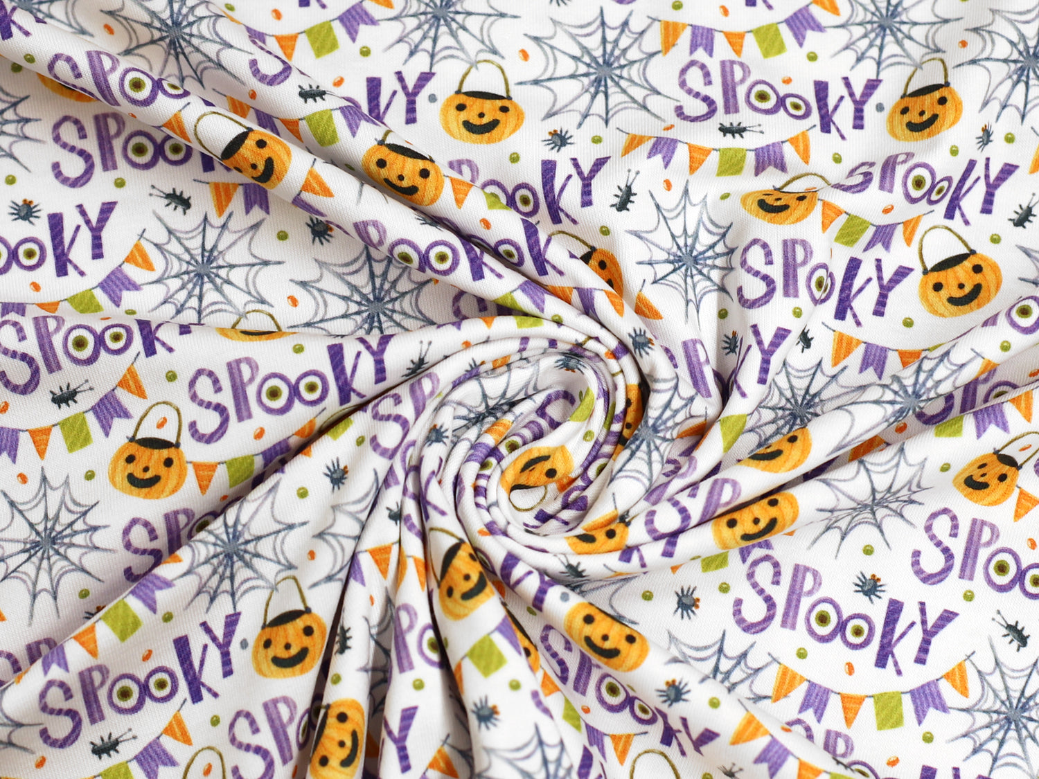 Jersey Stoff - SPOOKY design mit Kürbissen und Spinnen für Halloween Jersey Stoff, ideal für kreative Nähprojekte.