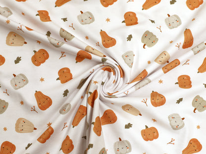 smiling pumpkin jersey fabric featuring cute, colorful pumpkin patterns on a soft, stretchy material.
