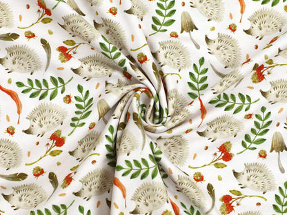 herbstlicher jersey stoff mit igelmotiv in buntem Design mit Igeln und herbstlichen Pflanzen auf hellem Hintergrund