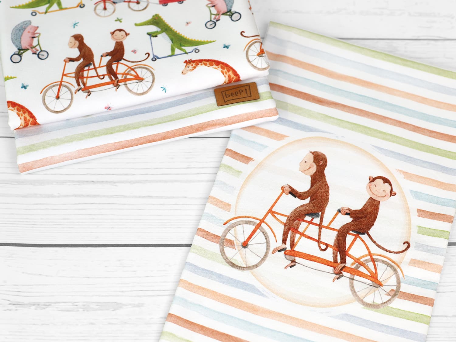 stoff-jersey-baumwolle-baumwolljersey-kathi-kunterbunt-tiere-affe-auf-fahrrad-panel-serie