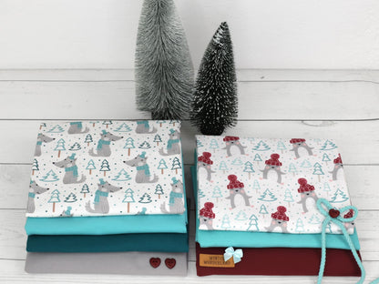 stoff-jersey-baumwolle-baumwolljersey-kathi-kunterbunt-winter-pinguin-mit-muetze-wolf-mit-schal-baum-im-wald-mint
