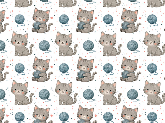 cat print jersey fabric featuring cute kittens and yarn balls in a playful pattern.