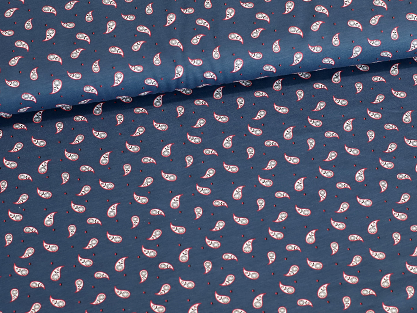 Mini Paisley jersey fabric in jeansblau with a small paisley design, perfect for various sewing projects.
