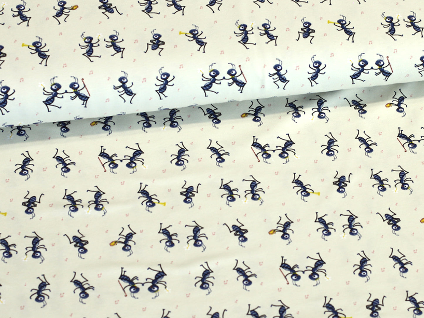 party ants cotton jersey fabric featuring playful ants on a cream background, perfect for fun sewing projects.