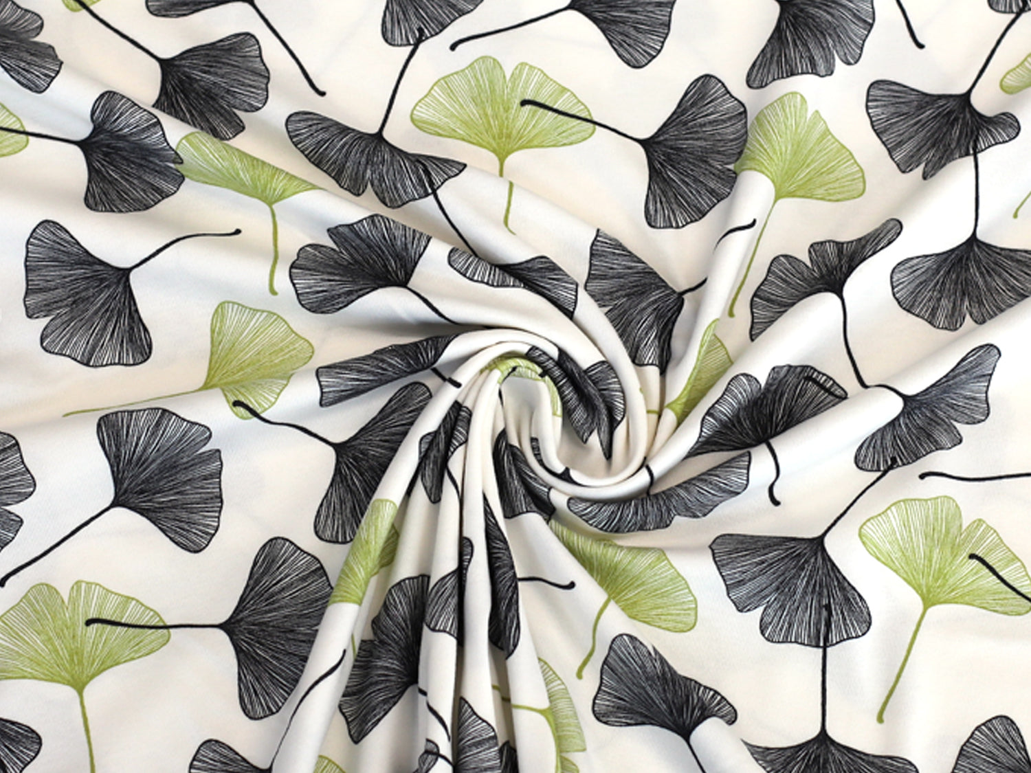 ginkgo cotton jersey fabric with black and green ginkgo leaves on a cream background