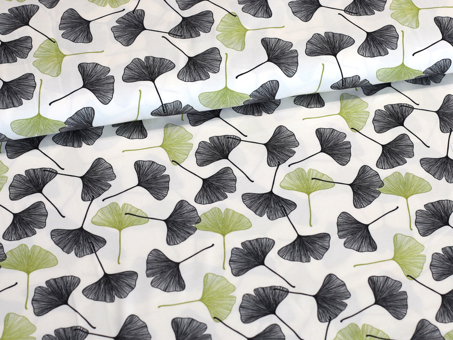 ginkgo cotton jersey fabric featuring beautiful ginkgo leaves on a cream background, ideal for stylish sewing projects.