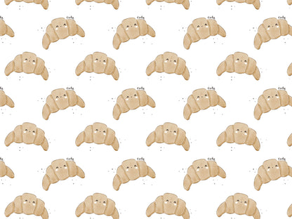 Cute croissant jersey fabric with playful croissant pattern on a light background.