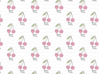 Lightweight cherry print jersey fabric featuring adorable cherries and playful text design on a soft background.