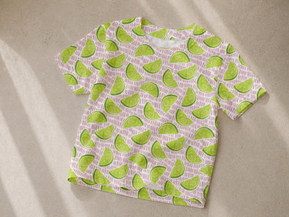 Jersey Stoff Limone kaufen, leichter Sommertop mit Limettenmuster auf hellem Hintergrund.