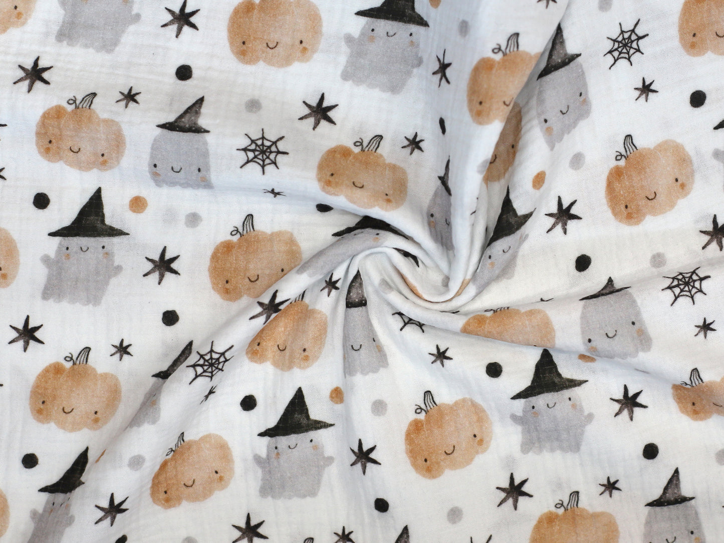 Halloween musselin fabric featuring adorable ghosts, pumpkins, and stars pattern.