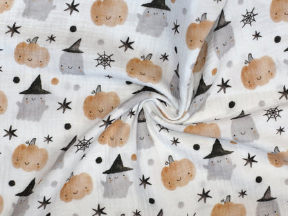 Halloween musselin fabric featuring adorable ghosts, pumpkins, and stars pattern.