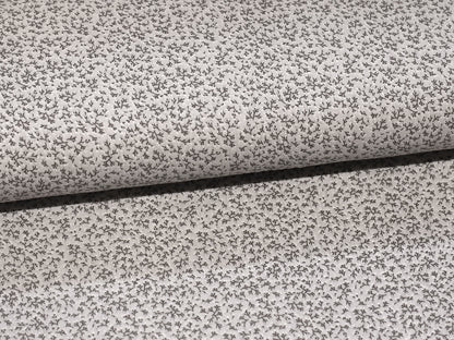 hellgrau musselin stoff mit feinem Muster aus kleinen Zweigen auf Baumwollmaterial.