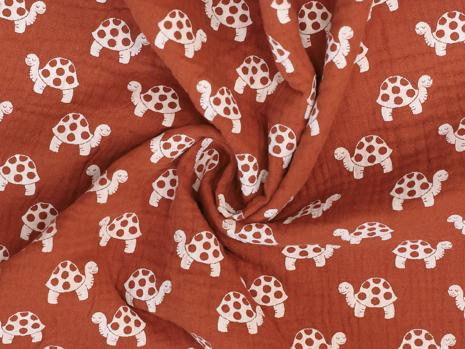Musselin - Schildkröte - terracotta, 100% Baumwolle Stoff mit Schildkröten-Muster in terracotta.