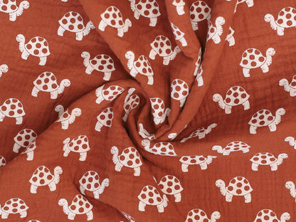 Musselin - Schildkröte - terracotta, 100% Baumwolle Stoff mit Schildkröten-Muster in terracotta.