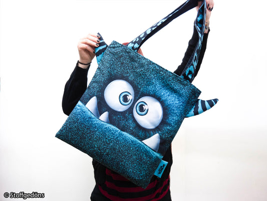 Petrol MONSTA BAG featuring a playful monster design, perfect for casual outings and everyday use.