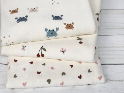 stoff-stretch-frottee-baumwolle-polyester-verschiedene-muster-cremeweiss