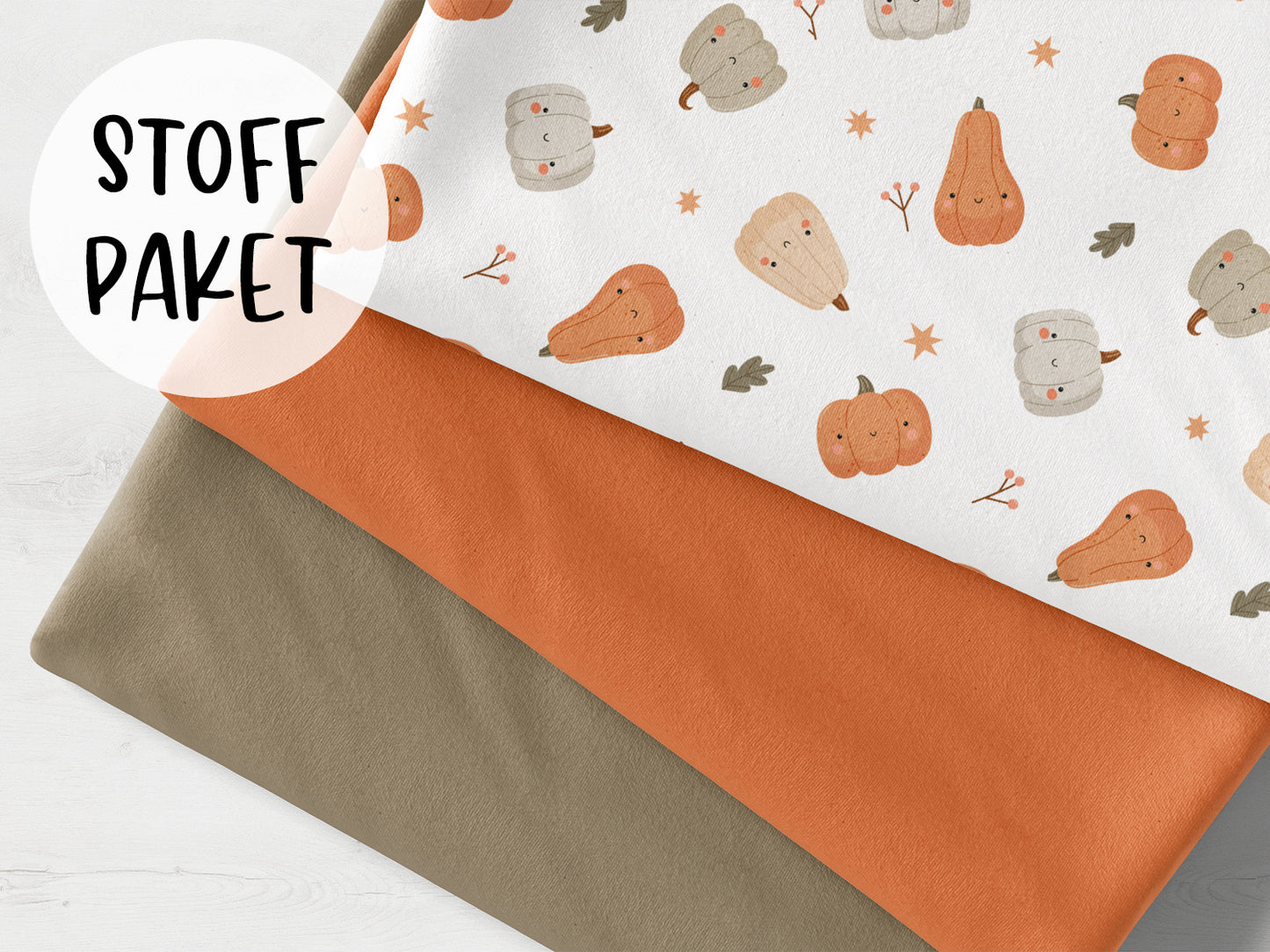 Stoffpaket - Lächelnde Kürbisse - schlamm, mit Jersey Stoffen in orange und schlamm für kreative Nähprojekte.