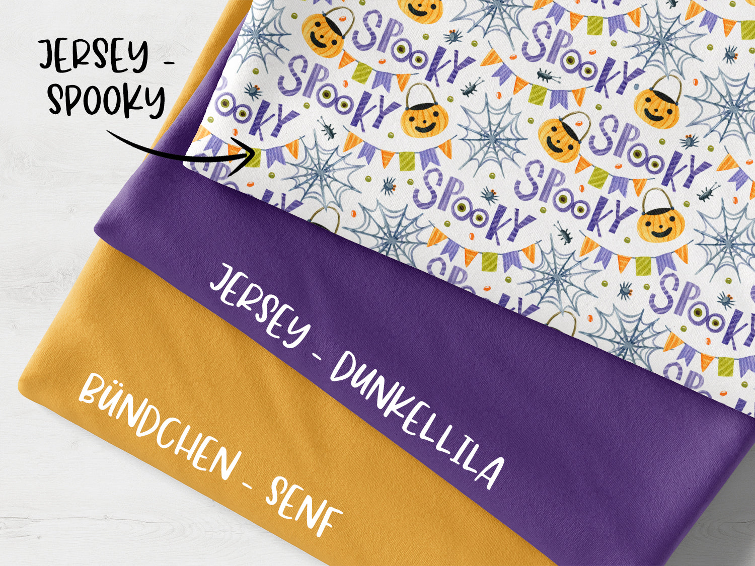 Spooky fabric bundle mustard featuring patterned jersey and solid fabrics in purple and mustard colors.